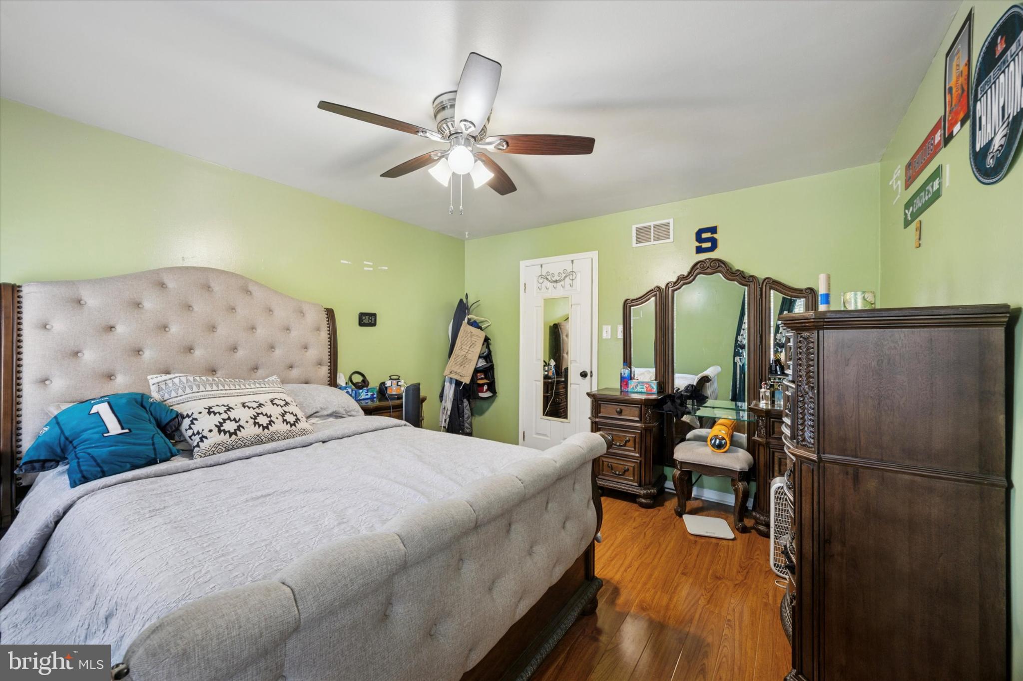 506 Flora Circle Springfield, PA 19064 - Photo 23 of 35 a bedroom with double bed and a chandelier