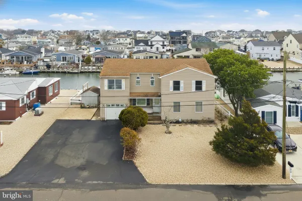a view of a house with outdoor space and sitting area