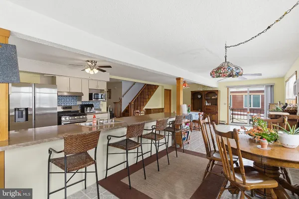 a view of a dining room with furniture window and outside view
