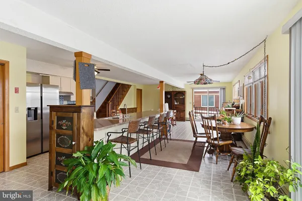 a view of a livingroom with furniture and a rug