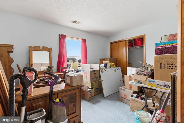 a room with gym equipment and windows
