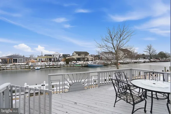 a view of a chairs and table on wooden floor