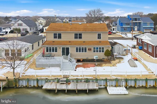a large building with a lot of trees in front of it