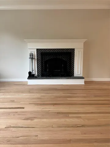 a view of an empty room and fire place