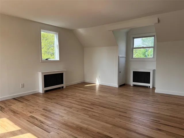 a view of empty room with windows