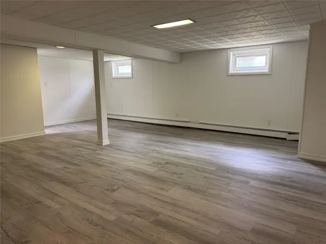a utility room with dryer washer and a refrigerator