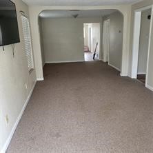 3502 Europa Street Houston, TX 77022 - Photo 1 of 4 a view of a livingroom with an empty space and a flat screen tv