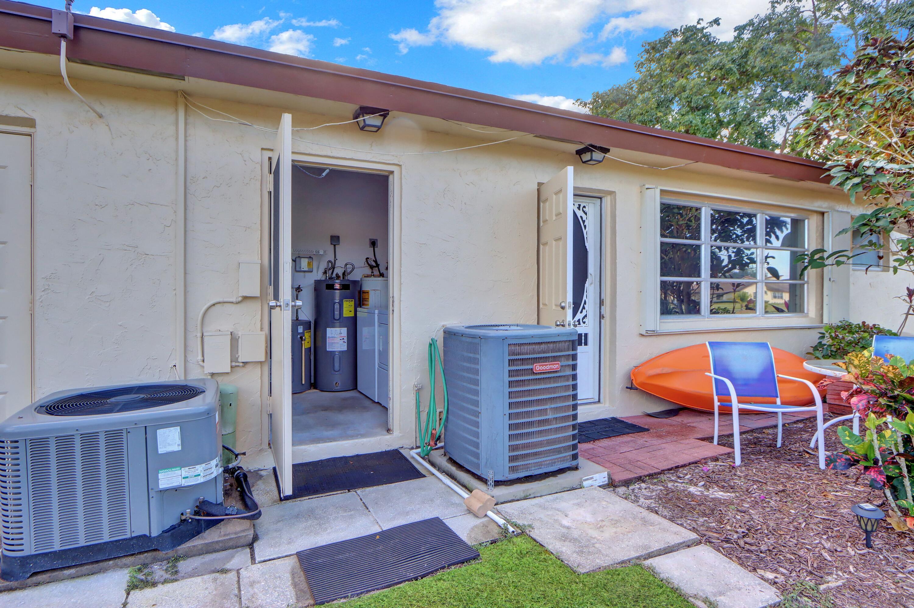 14050 Nesting Way, Unit B Delray Beach, FL 33484 - Photo 16 of 17 a view of living room kitchen and entryway