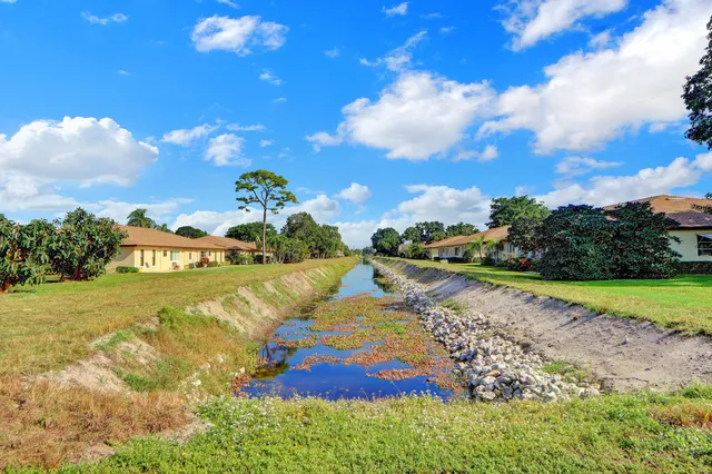 a view of a lake with a yard