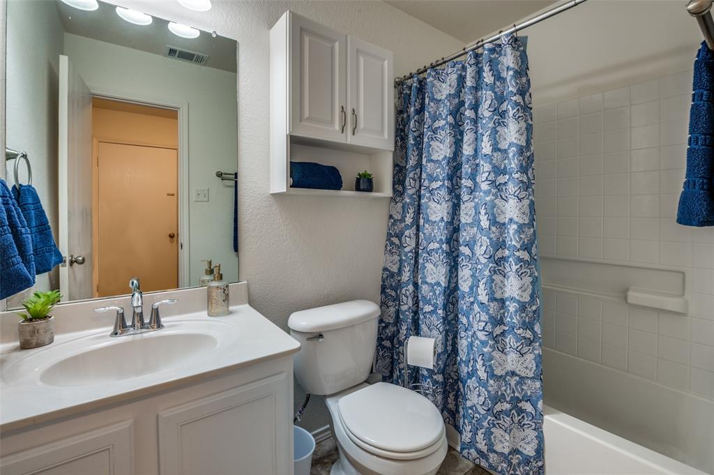 728 Falcon Road Saginaw, TX 76131 - Photo 17 of 30 a bathroom with a sink toilet and shower