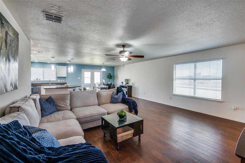 728 Falcon Road Saginaw, TX 76131 - Photo 5 of 30 a living room with furniture and a large window