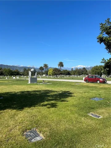 a view of a water fountain and a big yard