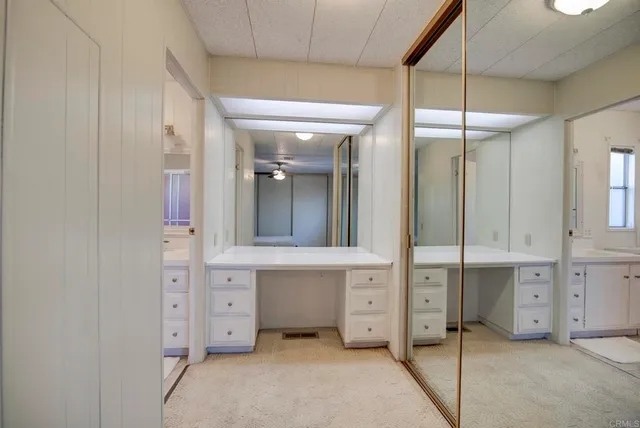 a bathroom with a mirror and a shower
