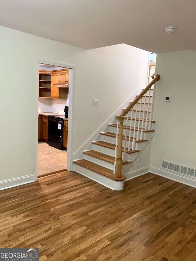 3019 Trafalgar Way Chamblee, GA 30341 - Photo 3 of 15 a view of entryway and hall with wooden floor