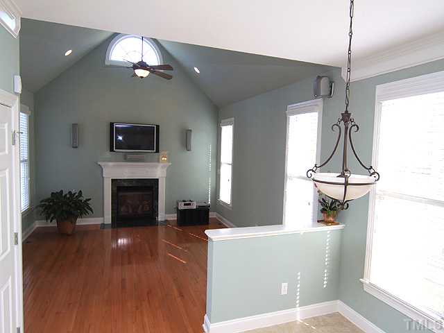 2500 Happy Lane Raleigh, NC 27614 - Photo 4 of 23 Family room has hardwoods, lots of light,ceiling fan, cathedral ceiling, sound system. Good proximity to the kitchen and the back deck.