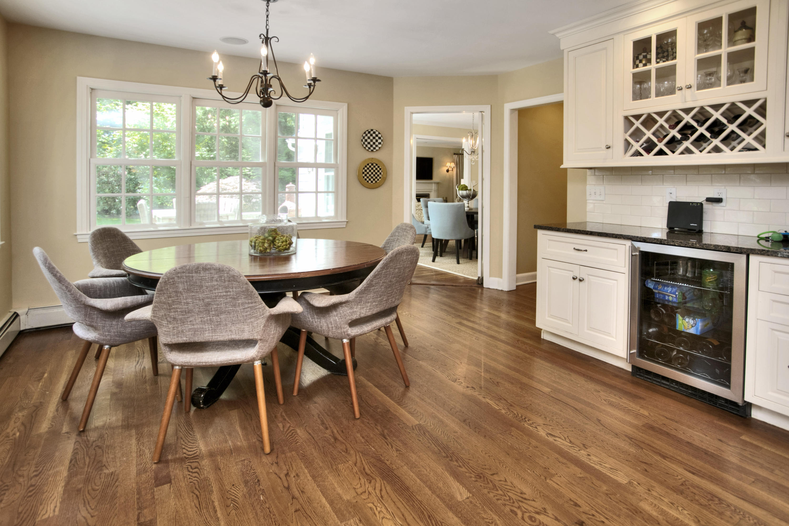 17 Rocaton Road Darien, CT 06820 - Photo 12 of 26 a dining room with furniture a chandelier and wooden floor