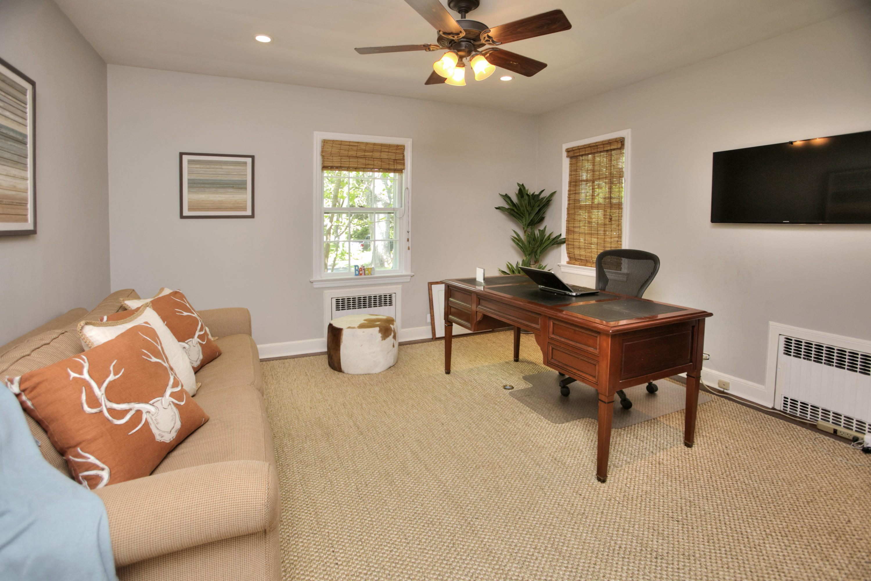 17 Rocaton Road Darien, CT 06820 - Photo 15 of 26 a living room with furniture and a flat screen tv