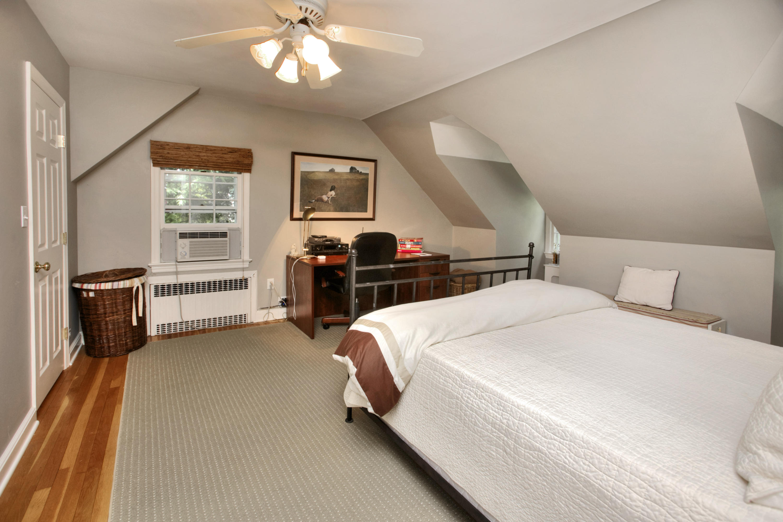 17 Rocaton Road Darien, CT 06820 - Photo 18 of 26 a bedroom with a bed and a chandelier