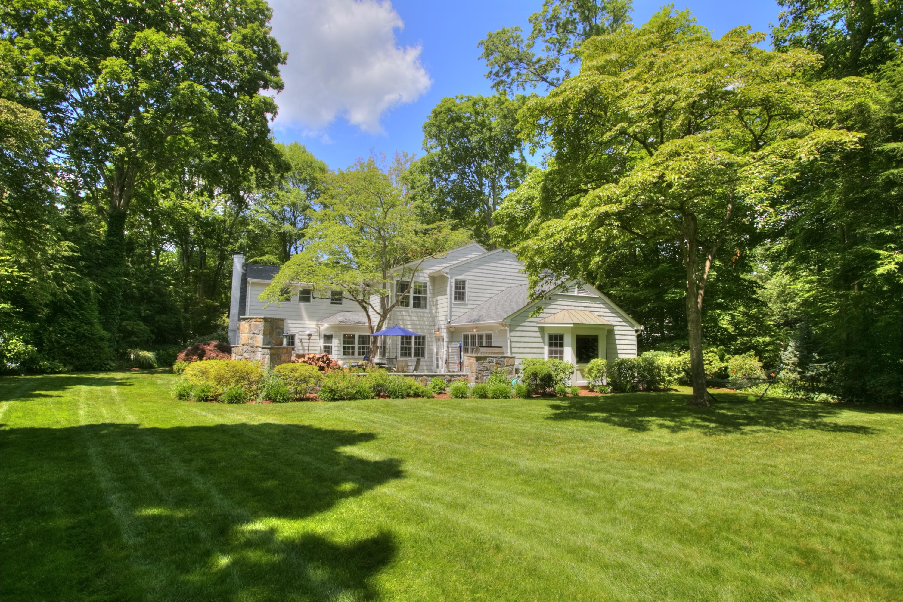 17 Rocaton Road Darien, CT 06820 - Photo 3 of 26 a front view of house with yard and green space