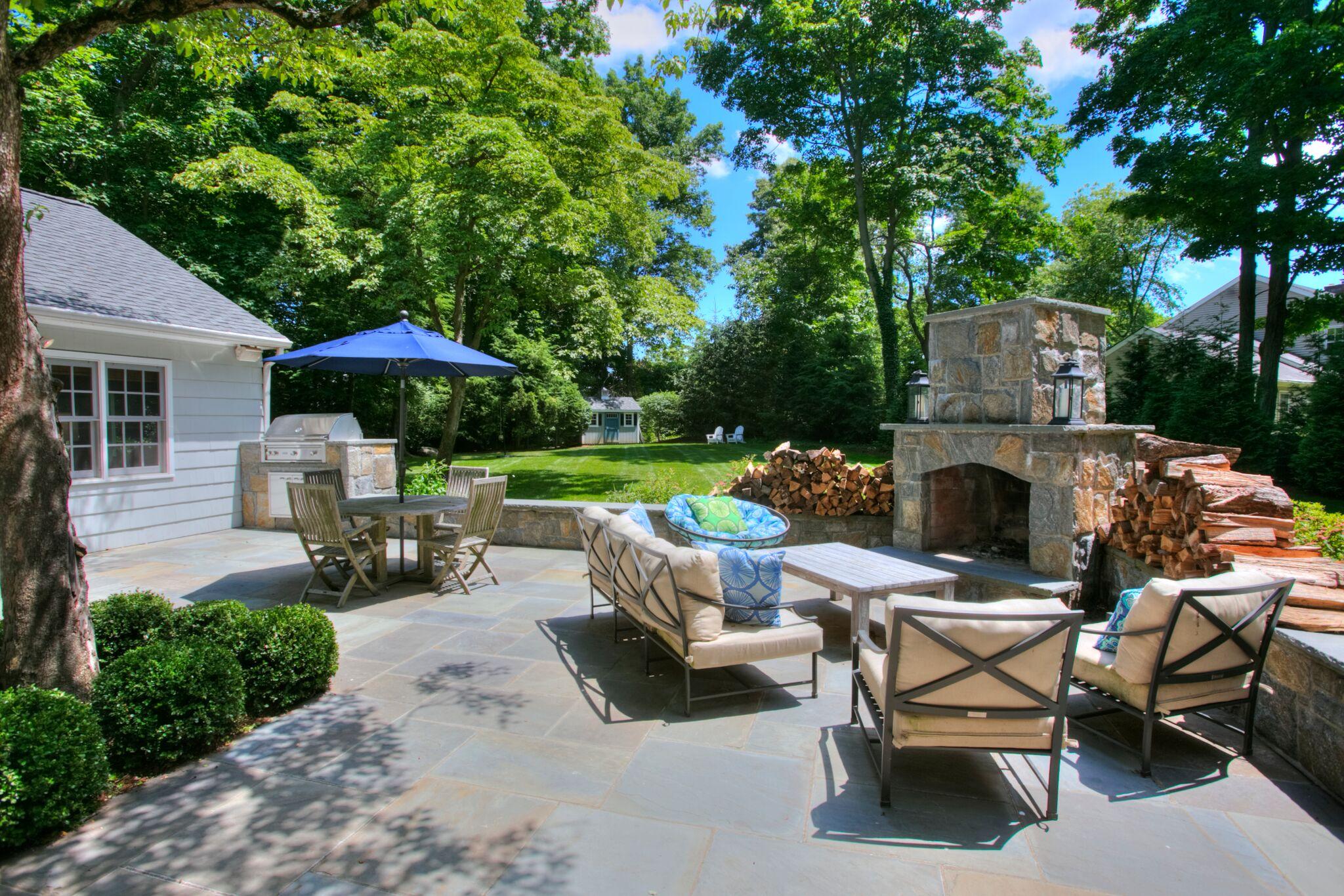 17 Rocaton Road Darien, CT 06820 - Photo 4 of 26 a view of backyard with outdoor seating barbeque oven and trees