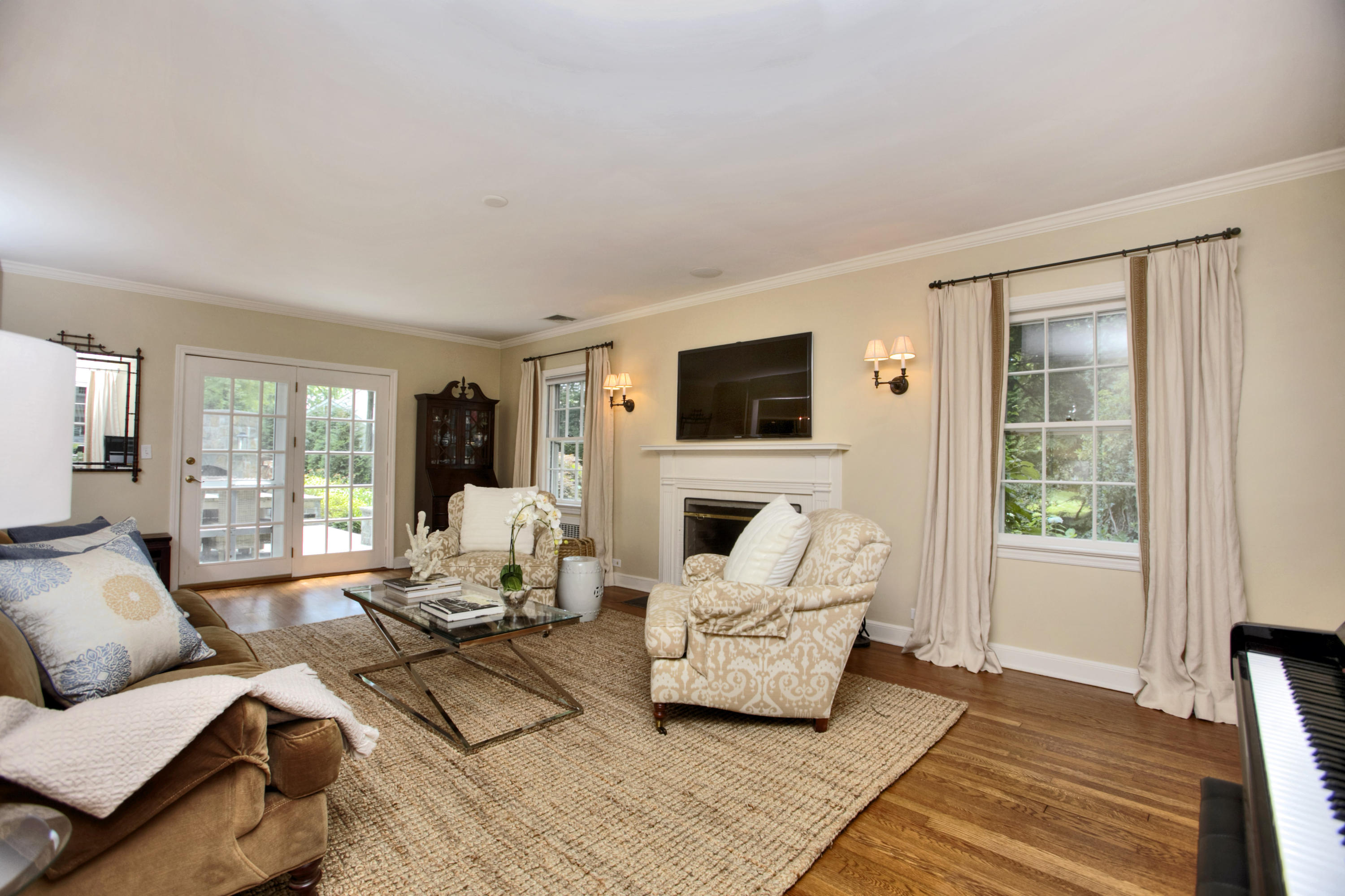 17 Rocaton Road Darien, CT 06820 - Photo 6 of 26 a living room with furniture and a flat screen tv