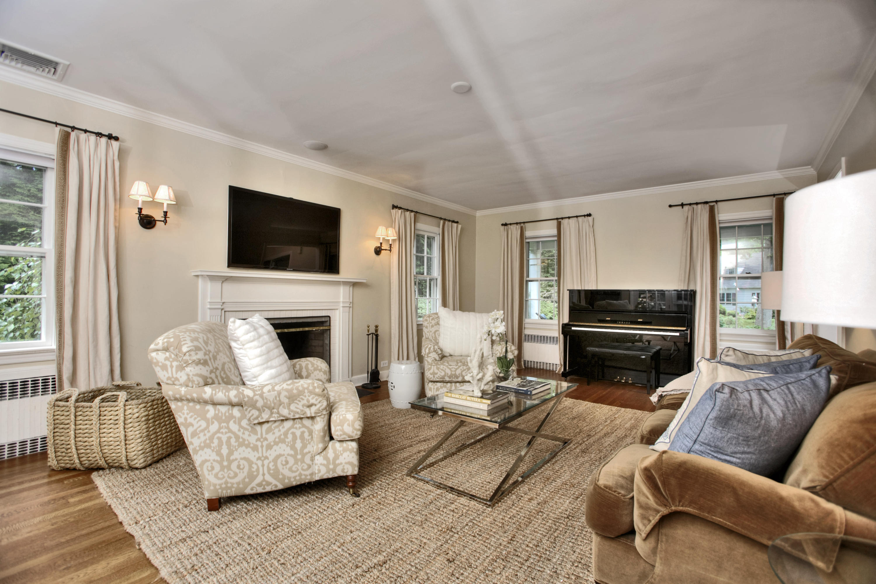 17 Rocaton Road Darien, CT 06820 - Photo 7 of 26 a living room with furniture a fireplace and a flat screen tv