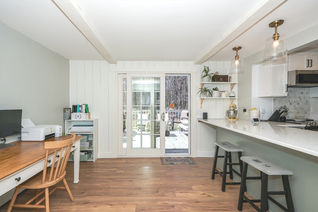 32 Reservoir Road Lunenburg, MA 01462 - Photo 6 of 42 a view of a dining room with furniture and wooden floor
