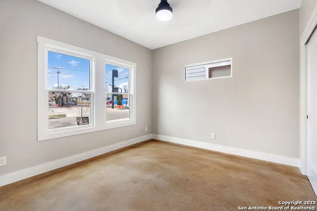 a view of an empty room with a window