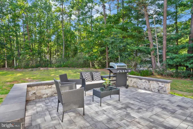 a view of a chairs and table in the garden