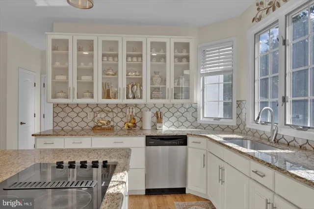 a kitchen with a sink and cabinets