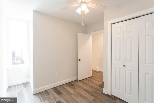 a view of a livingroom with wooden floor