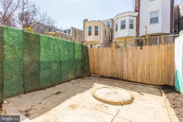 a view of a back yard of a house