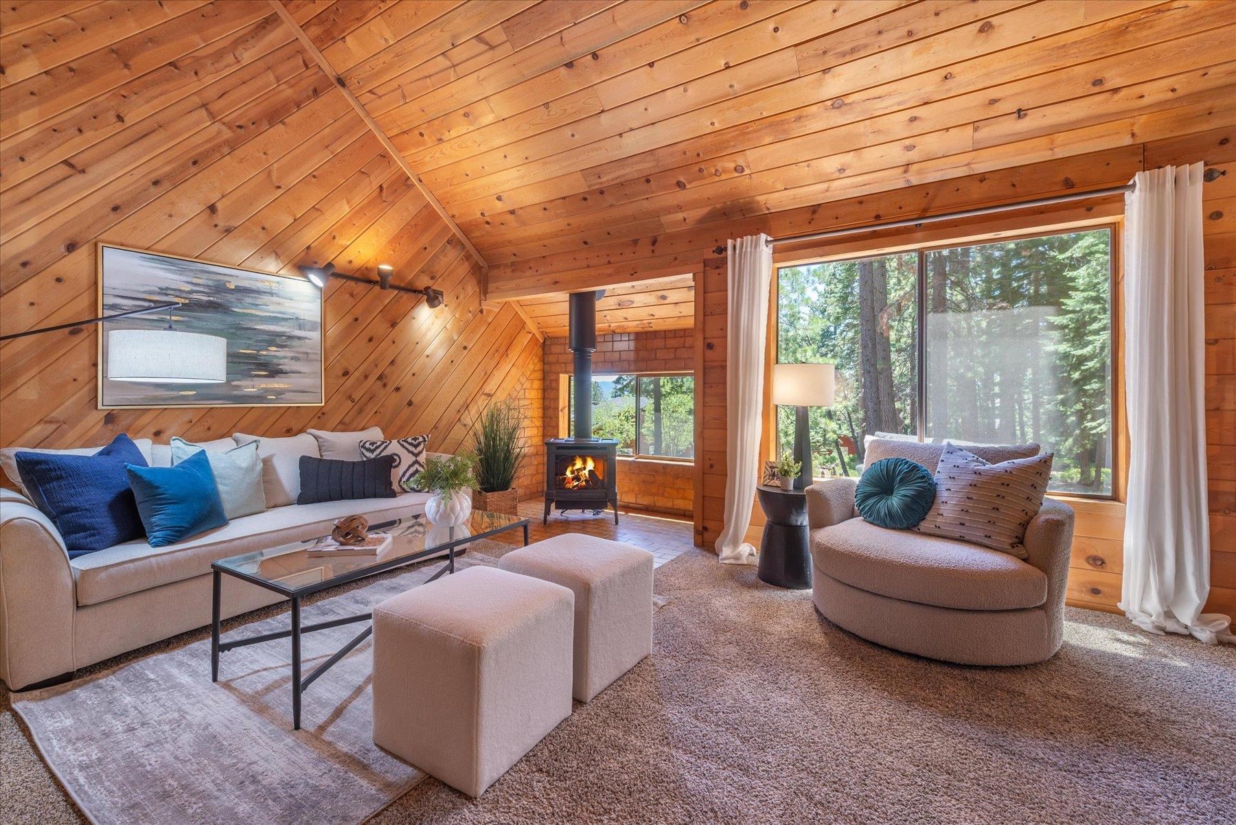 325 North Ridge Road Carnelian Bay, CA 96140 - Photo 8 of 22 a living room with furniture and a large window