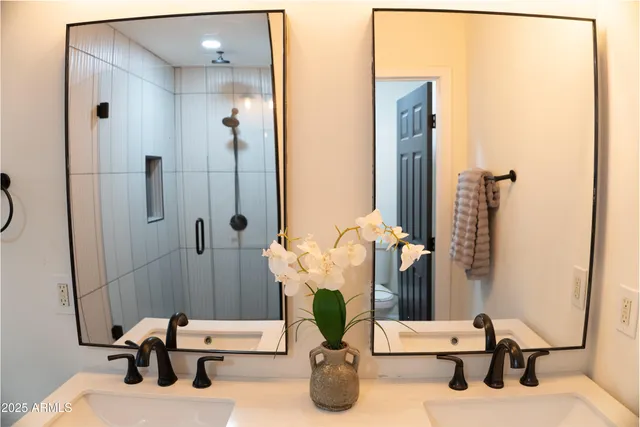 a bathroom with a sink and mirror
