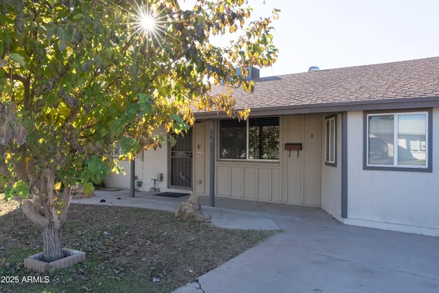 a view of a house with a tree