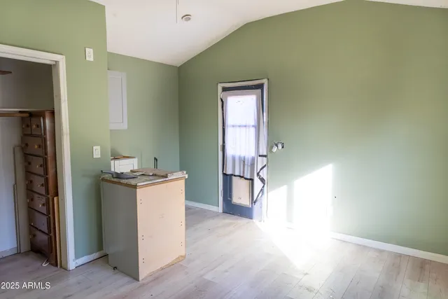 an entryway and livingroom with furniture