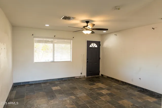 a view of an empty room with a window