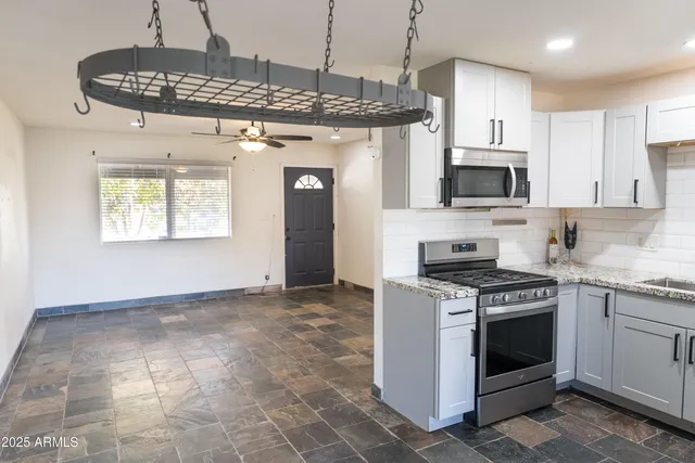 a kitchen with a stove and a sink