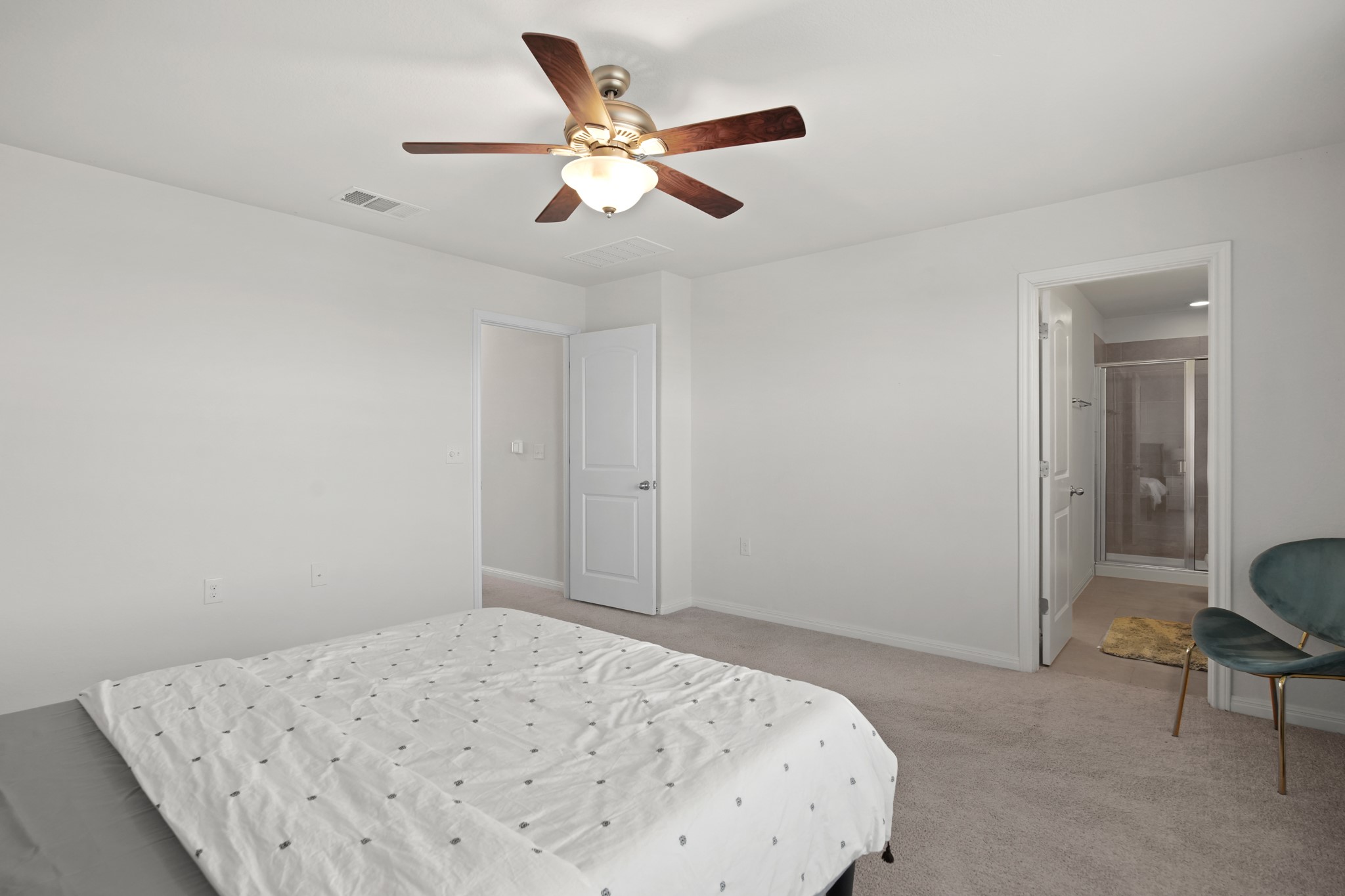 13005 Foreston Drive Austin, TX 78754 - Photo 29 of 36 a bedroom with a bed and a ceiling fan