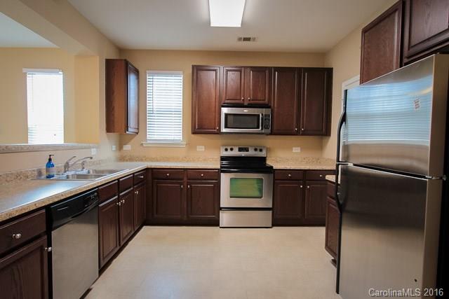 241 River Clay Road, Unit 179 Fort Mill, SC 29708 - Photo 4 of 24 a kitchen with a refrigerator stove and sink