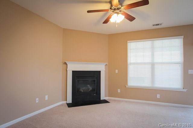 241 River Clay Road, Unit 179 Fort Mill, SC 29708 - Photo 5 of 24 a big room with windows and a fireplace