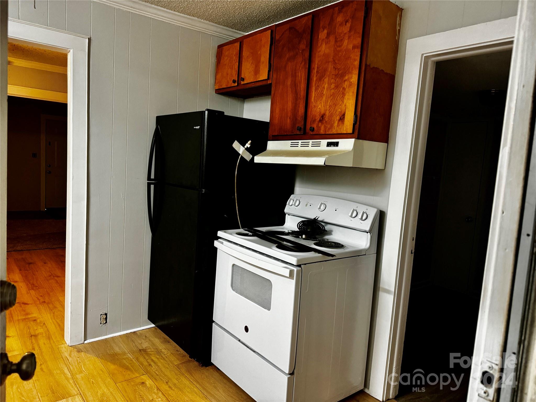 310 Pineview Street Kannapolis, NC 28083 - Photo 12 of 13 a kitchen with a stove and a refrigerator