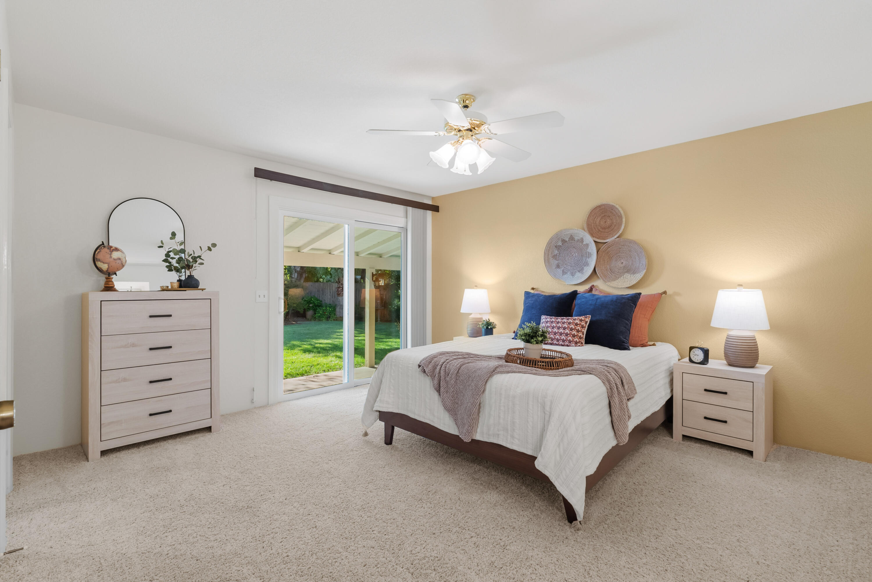 6812 Riata Drive Redding, CA 96002 - Photo 18 of 42 a bedroom with bed and a chandelier