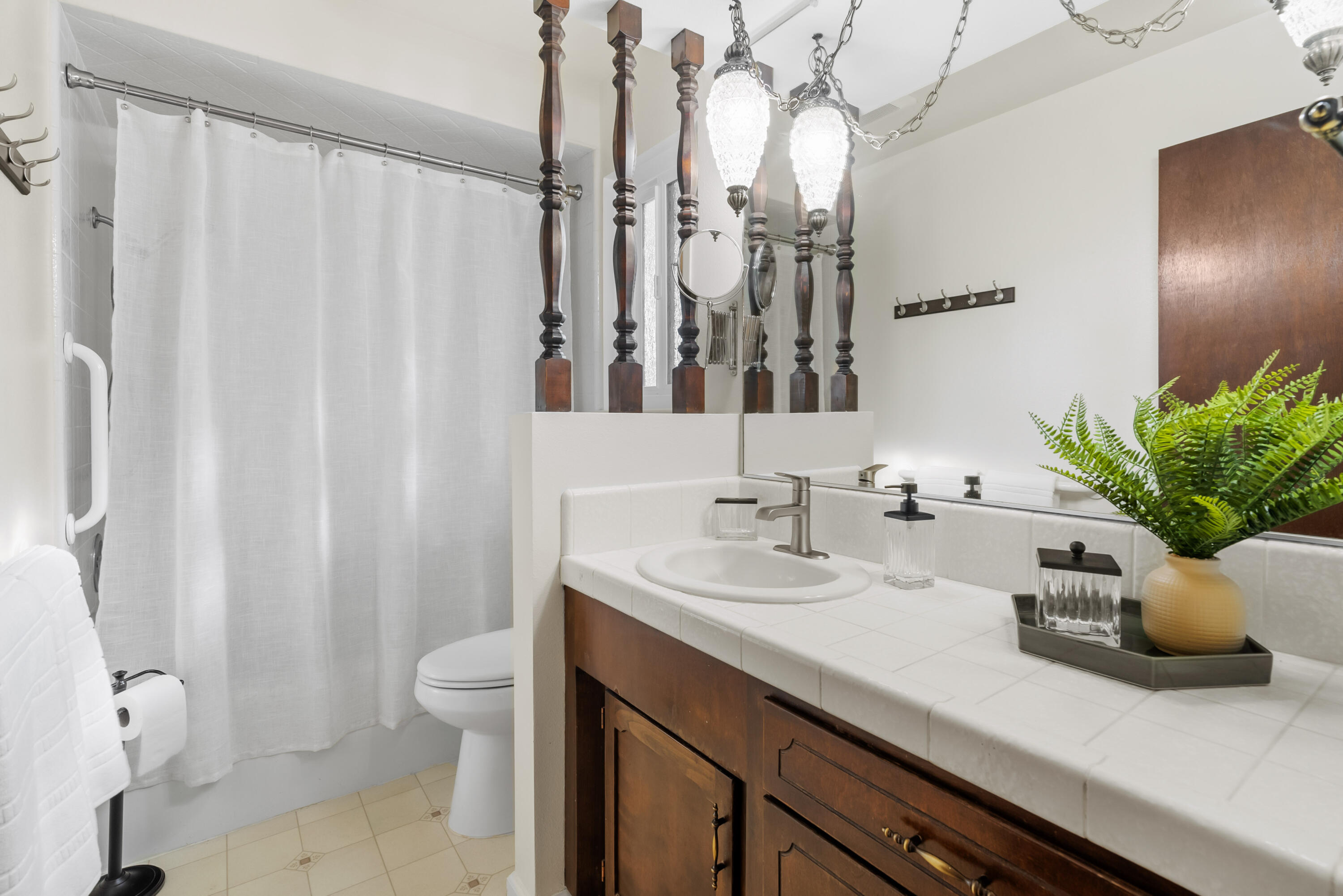 6812 Riata Drive Redding, CA 96002 - Photo 20 of 42 a bathroom with a sink a toilet and a mirror
