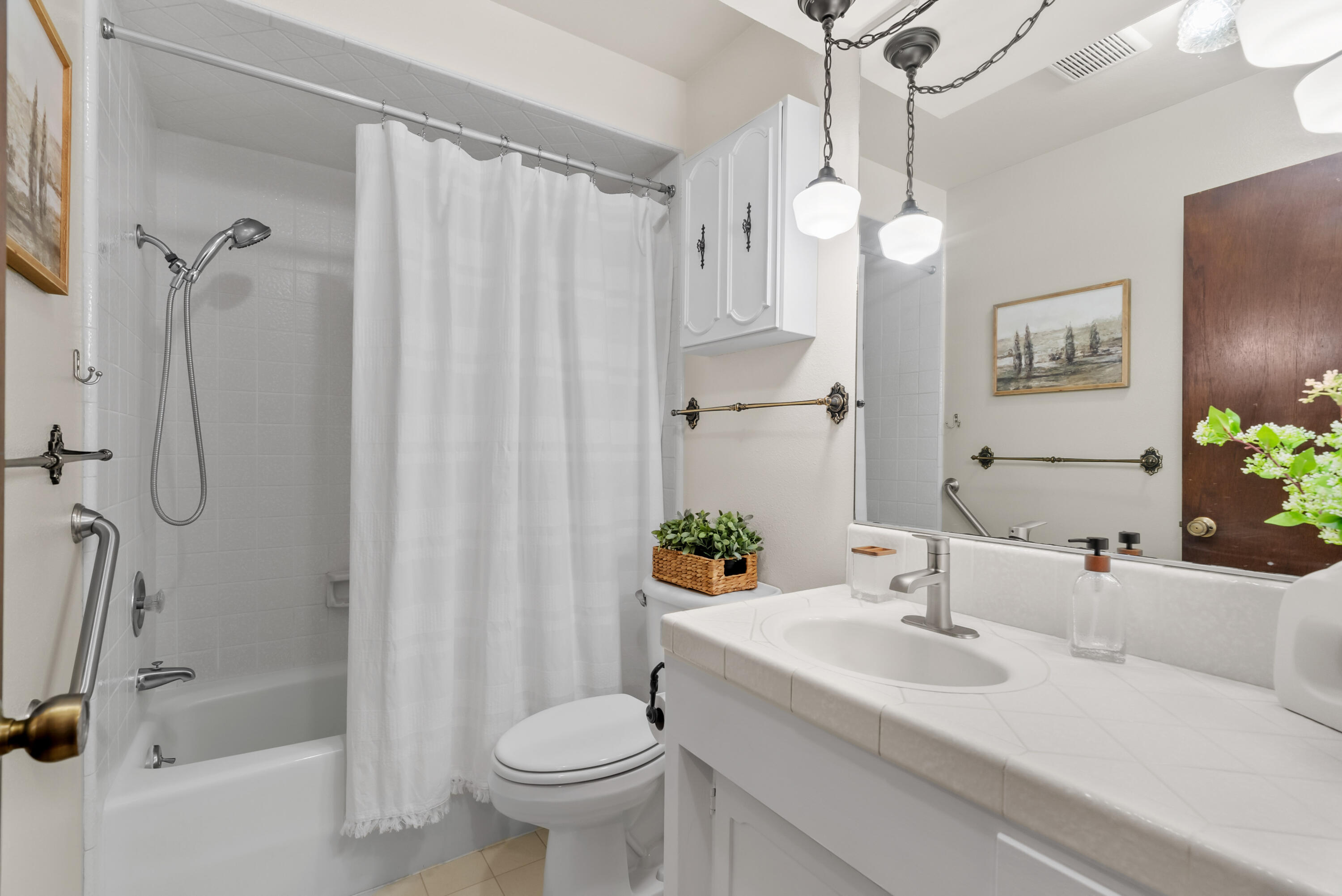 6812 Riata Drive Redding, CA 96002 - Photo 23 of 42 a bathroom with a sink toilet and shower