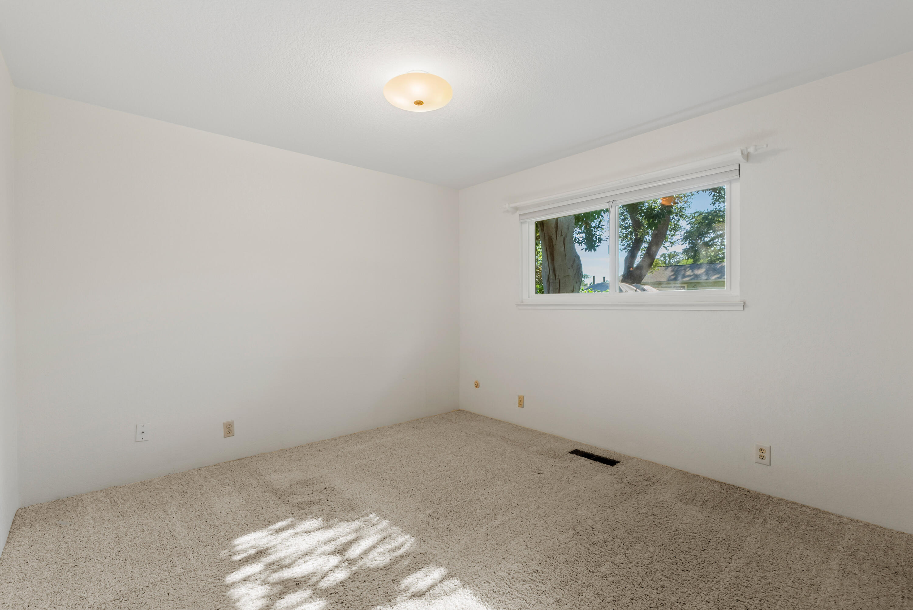 6812 Riata Drive Redding, CA 96002 - Photo 24 of 42 an empty room with windows