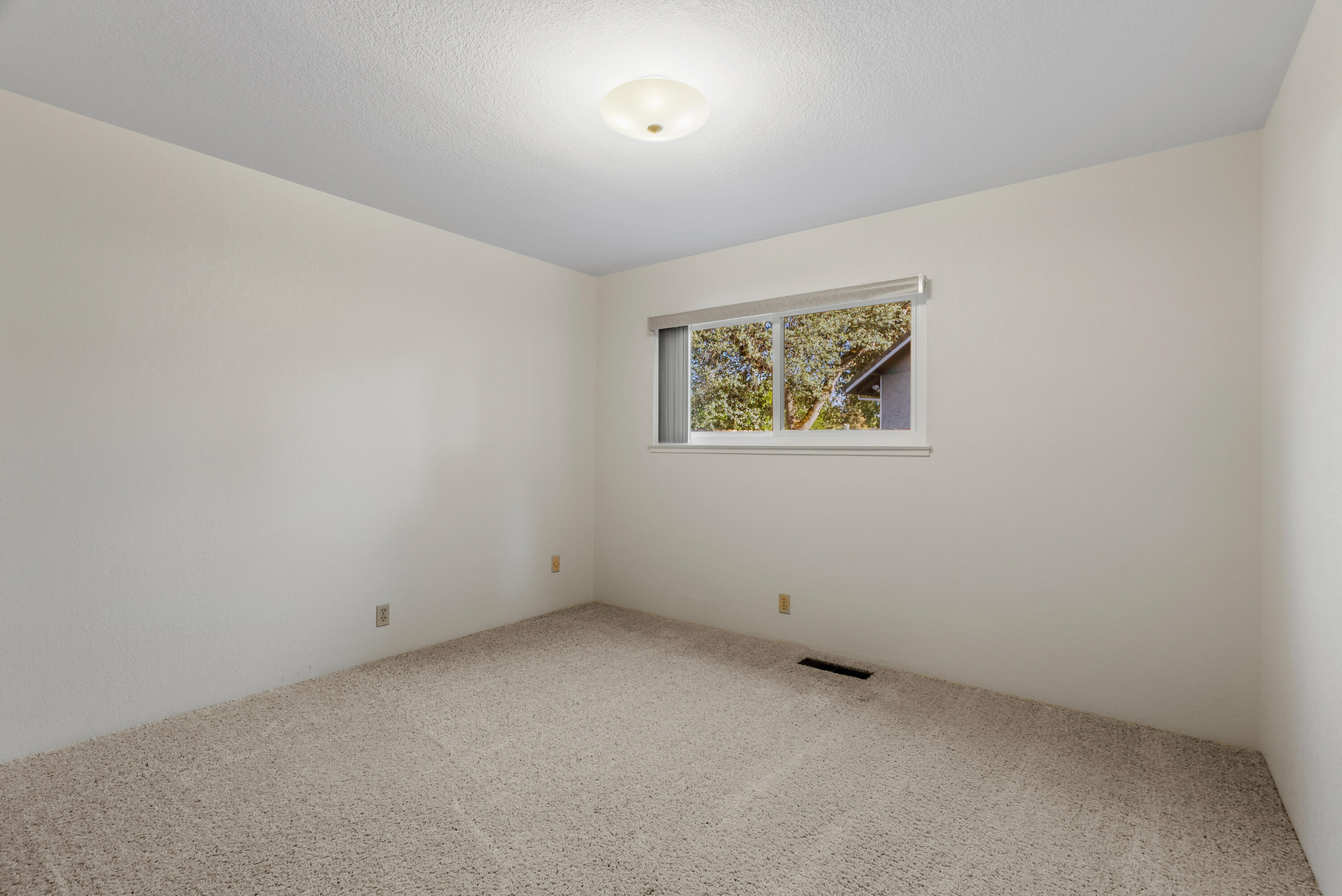 6812 Riata Drive Redding, CA 96002 - Photo 26 of 42 an empty room with a window