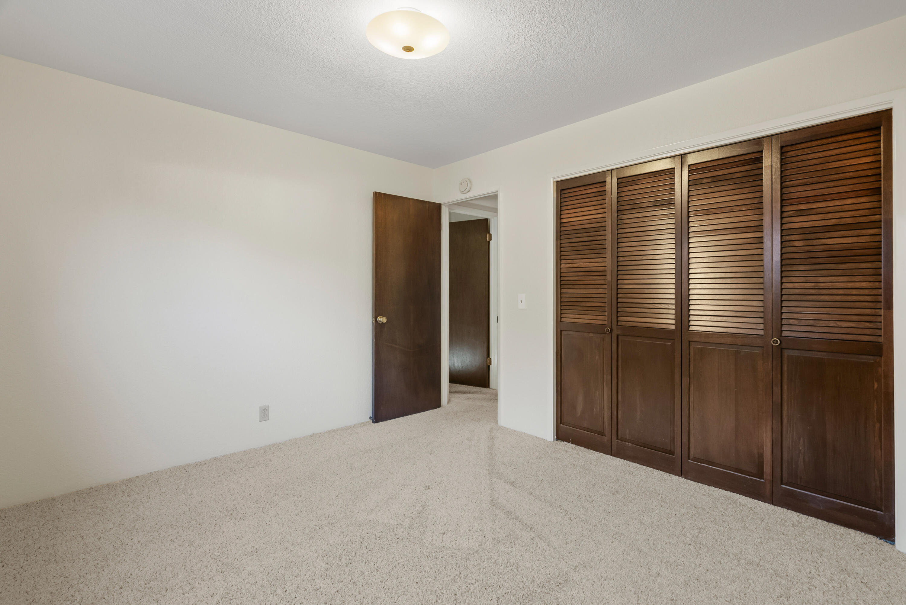 6812 Riata Drive Redding, CA 96002 - Photo 27 of 42 a view of an empty room with wooden floor