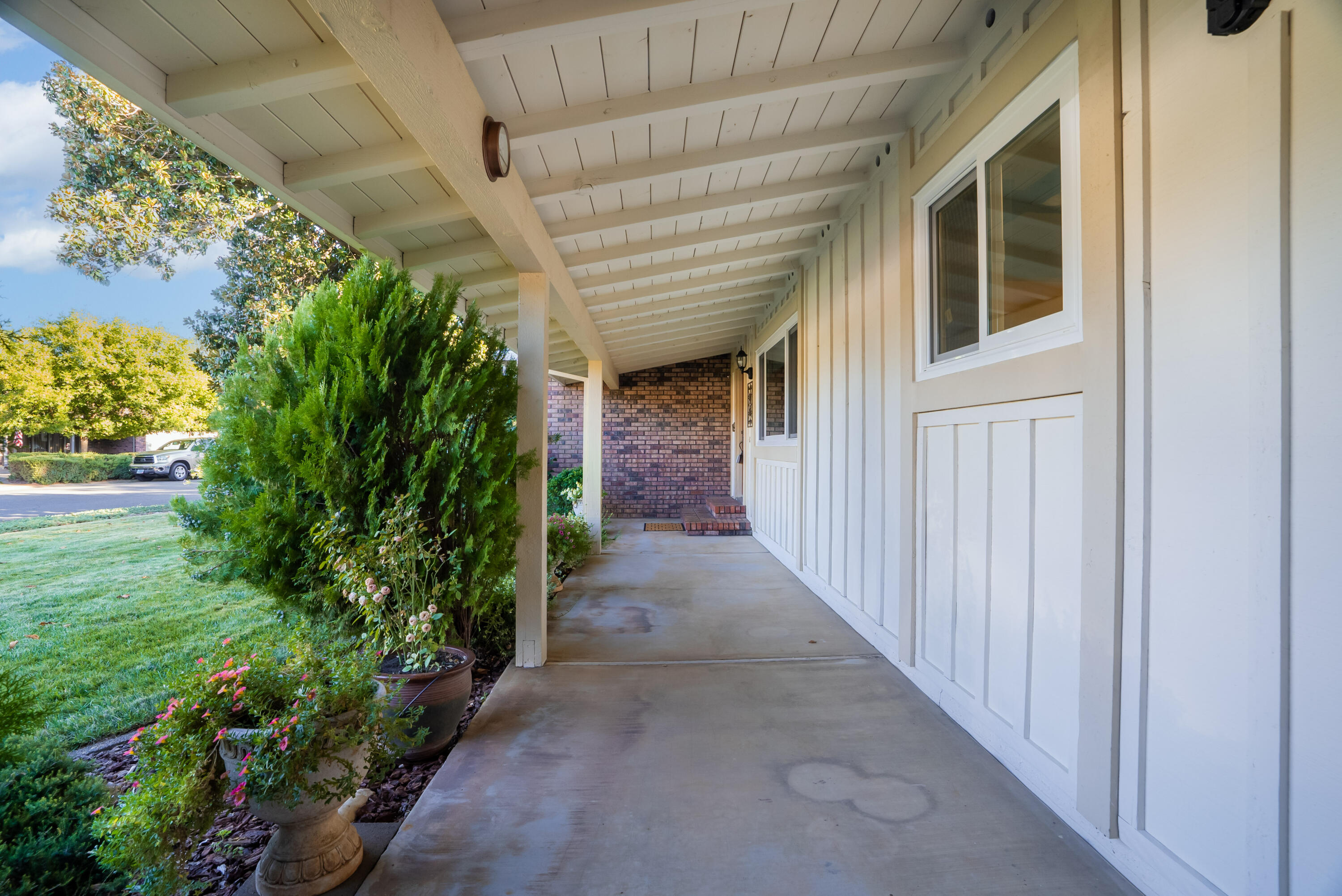 6812 Riata Drive Redding, CA 96002 - Photo 3 of 42 a view of a pathway of a house with plants