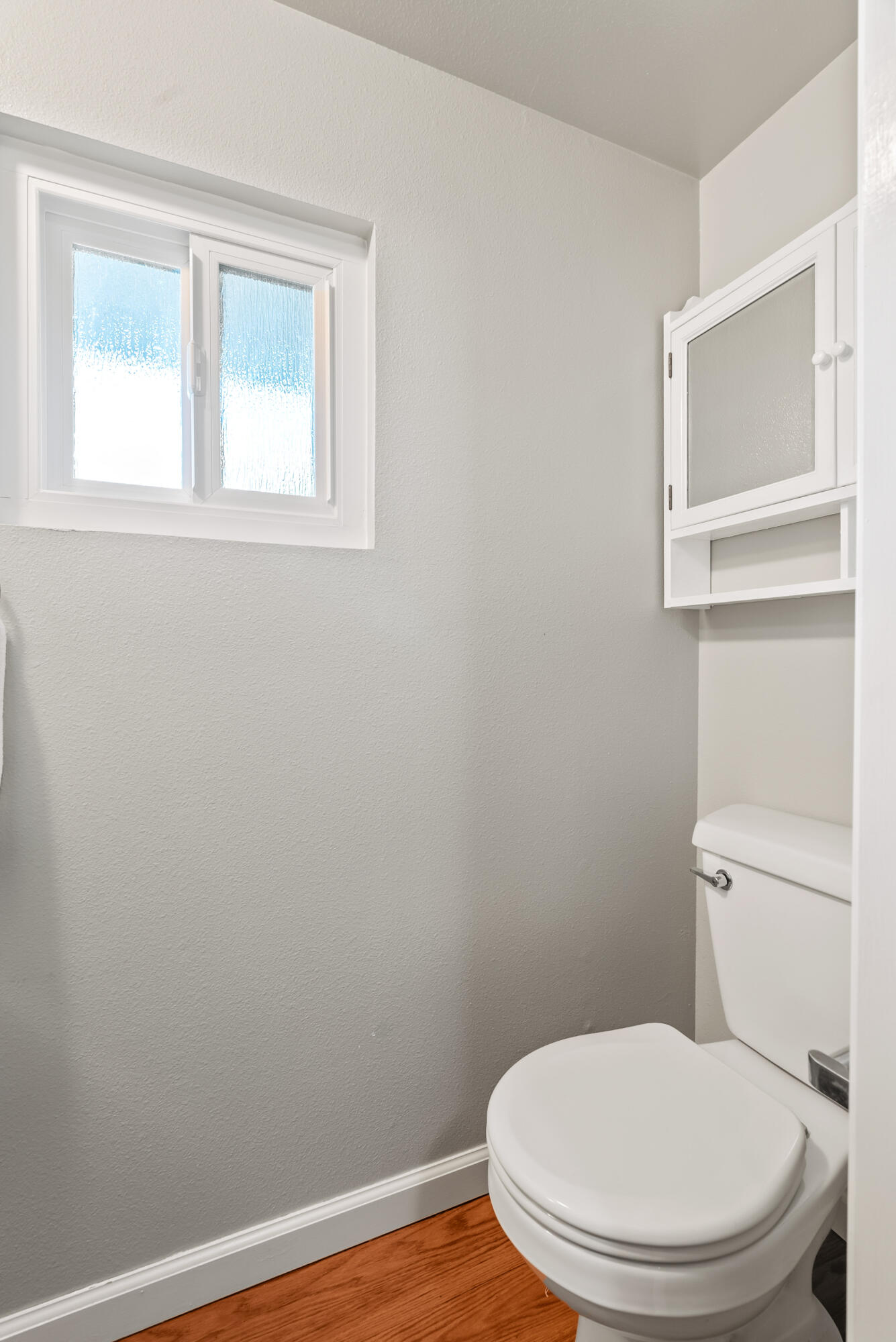 6812 Riata Drive Redding, CA 96002 - Photo 31 of 42 a white toilet sitting next to a window